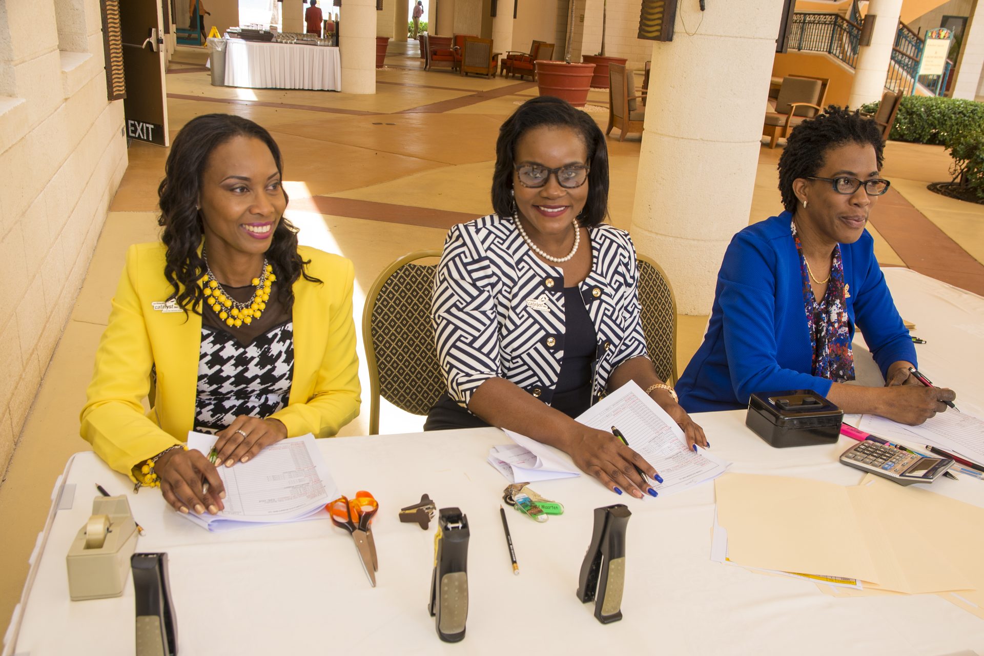 CCI team members Angela, Junelle and Jennifer at the registration desk