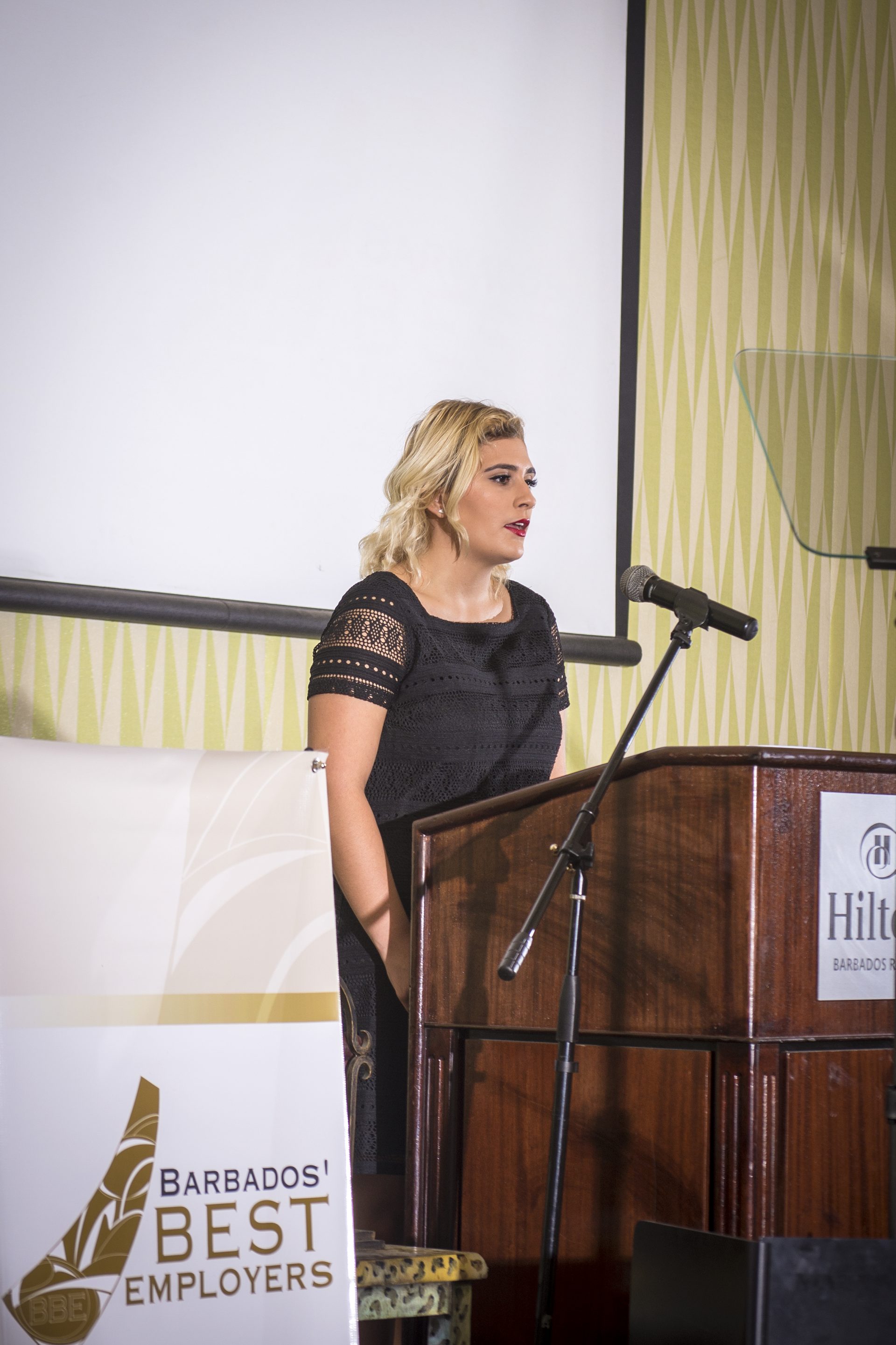 Paige Wills officially starting off the luncheon singing the National Anthem