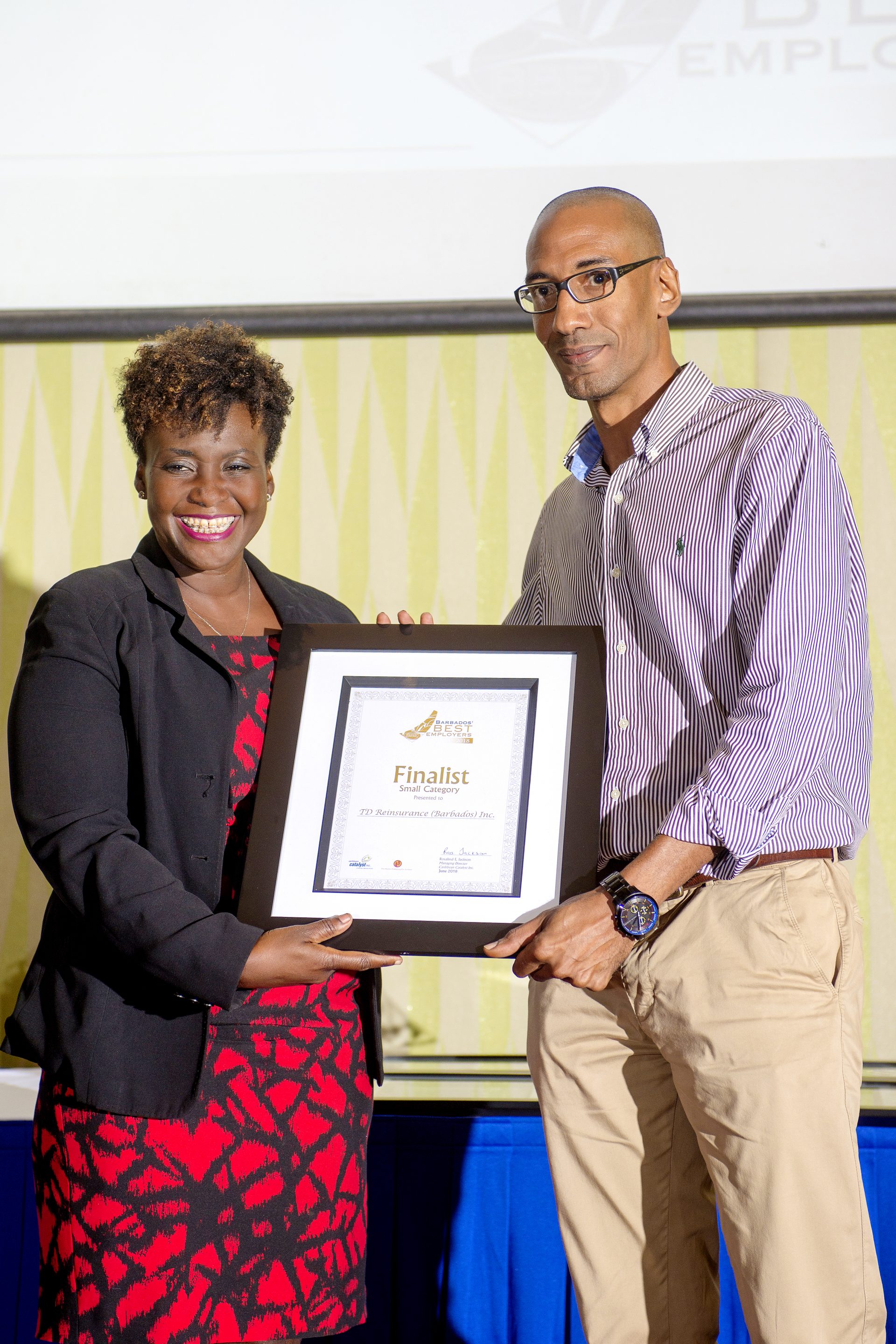 Valerie Hope presenting Paul Reece at TD Reinsurance with a Certificate as one of the Finalist in the Small category.
